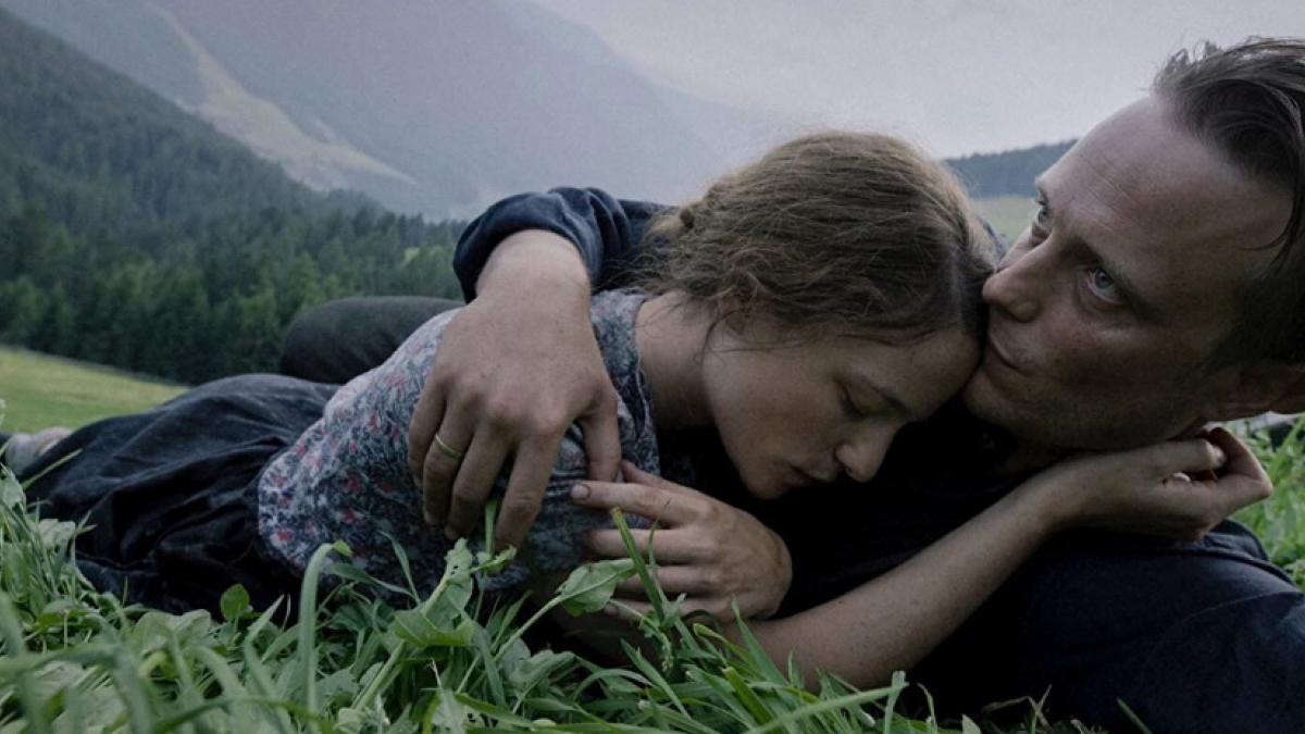 Franz (August Diehl, right) and Fani Jägerstätter (Valerie Pachner) savor everying they could lose in Terrence Malick's 'A Hidden Life'.