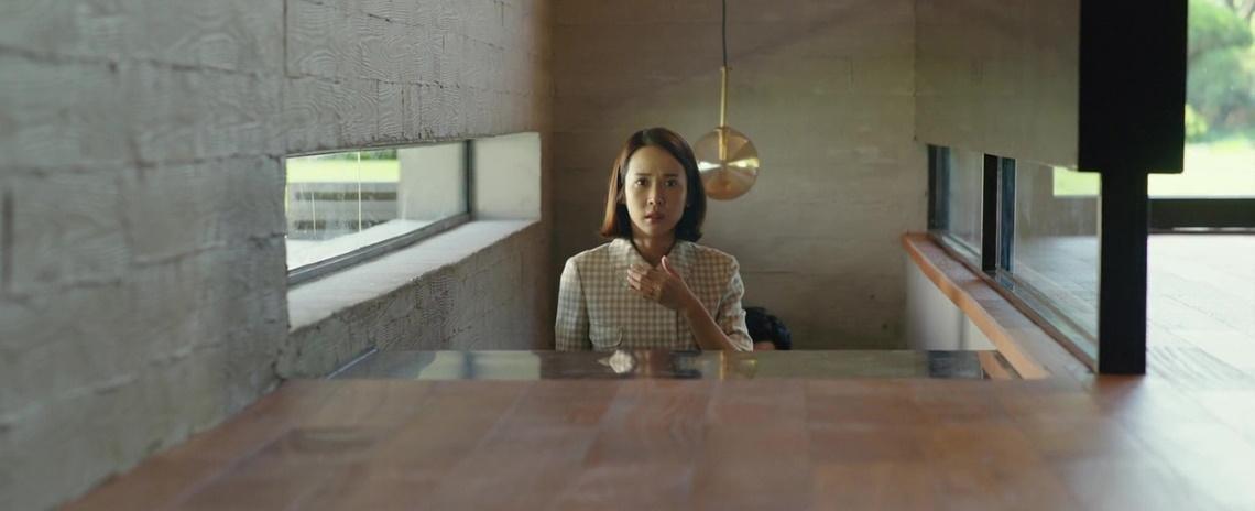 Mrs. Park (Jo Yeo-jeong) has more than one intruder in her home in Bong Joon Ho's Parasite.