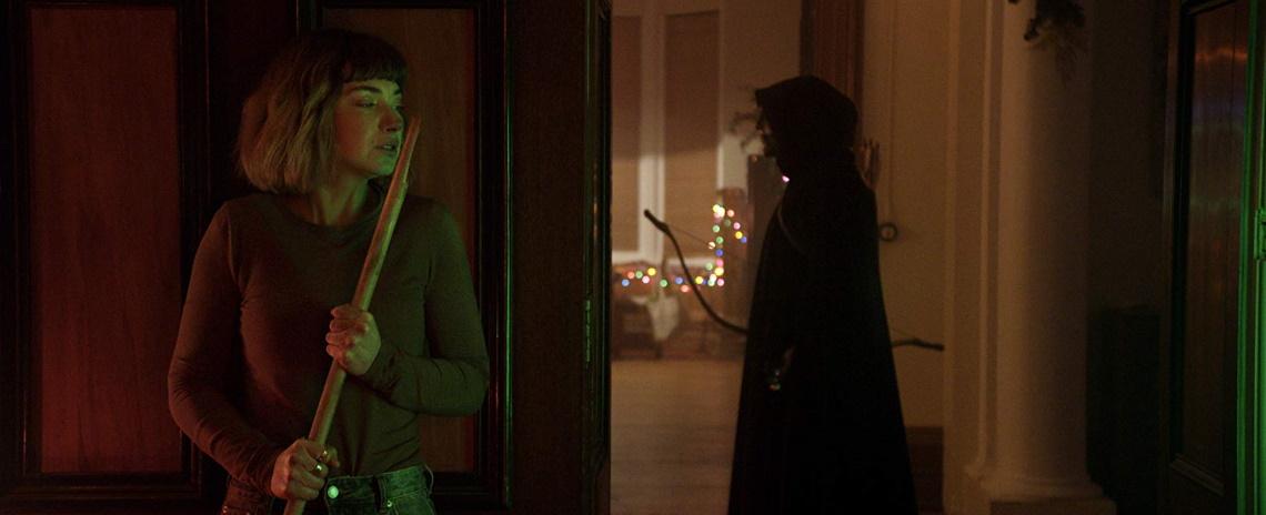 Riley (Imogen Poots, left) battles holiday intruders in Sophia Takal's 'Black Christmas'.