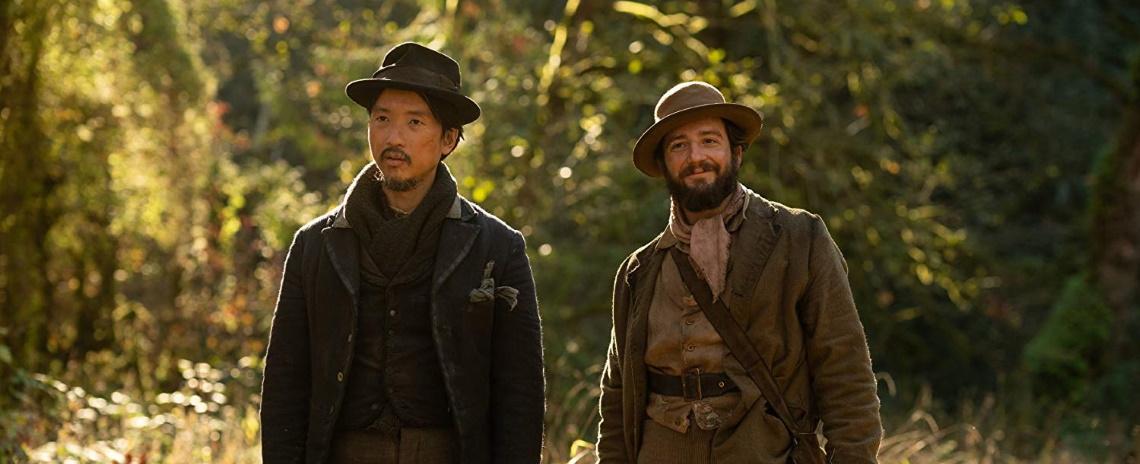 King Lu (Orion Lee, left) and Cookie Figowitz (John Magaro) forge a friendship over biscuits in Kelly Reichardt's 'First Cow'.